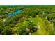 Aerial view showcasing a park-like setting with a river in the background at 5912 N Lynn Ave, Tampa, FL 33604