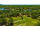Aerial view showcasing a park-like setting with a river in the background at 5912 N Lynn Ave, Tampa, FL 33604