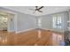 Spacious living room featuring hardwood floors, neutral walls, and multiple entryways at 5912 N Lynn Ave, Tampa, FL 33604