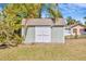 Backyard shed with double doors for storage at 5912 N Lynn Ave, Tampa, FL 33604