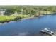 Scenic aerial view of waterfront property with private dock and boat slip and green space at 604 W Hilda St, Tampa, FL 33603