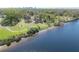 Stunning aerial view showcasing the waterfront property, with walking paths and mature trees at 604 W Hilda St, Tampa, FL 33603
