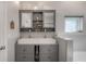 Contemporary bathroom with double sink vanity, sleek fixtures, and a stylish built-in mirror at 604 W Hilda St, Tampa, FL 33603