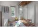 Bright bathroom featuring a glass-enclosed shower with a wooden floor and a sunny window at 604 W Hilda St, Tampa, FL 33603