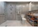 Modern bathroom features a standing shower, floating vanity, and industrial corrugated metal walls at 604 W Hilda St, Tampa, FL 33603