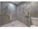 Clean and modern bathroom with a standing shower and handicap safety features at 604 W Hilda St, Tampa, FL 33603