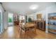 Bright dining area with hardwood floors, decorative accents, and a seamless flow to outdoor spaces at 604 W Hilda St, Tampa, FL 33603