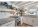 Stylish kitchen with granite countertops, stainless steel appliances, and ample cabinet space at 604 W Hilda St, Tampa, FL 33603