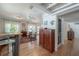 Open-concept living space features hardwood floors, natural light, and comfortable seating at 604 W Hilda St, Tampa, FL 33603