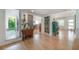Open-concept living space featuring hardwood floors and abundant natural light at 604 W Hilda St, Tampa, FL 33603
