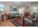 Comfortable living room featuring hardwood floors and plenty of natural light from the windows at 604 W Hilda St, Tampa, FL 33603