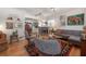 Cozy living room featuring hardwood floors, stylish furniture, and an open floor plan to the kitchen at 604 W Hilda St, Tampa, FL 33603