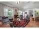 Bright living room with hardwood floors, stylish decor, and a cozy seating area at 604 W Hilda St, Tampa, FL 33603