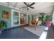 Inviting porch with dining table, wicker chairs, and stylish decor, perfect for outdoor entertaining at 604 W Hilda St, Tampa, FL 33603