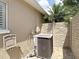 A modern AC unit positioned near the exterior wall, showcasing a well-maintained landscape and exterior at 6716 Frontier Ln, Tampa, FL 33625