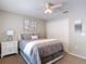Inviting bedroom with a comfortable bed, side table, and closet offering ample storage at 6716 Frontier Ln, Tampa, FL 33625