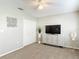 Cozy bedroom with neutral carpet, a ceiling fan, and closet at 6716 Frontier Ln, Tampa, FL 33625