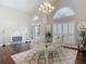 Open dining area with shuttered windows and modern decor, perfect for entertaining at 6716 Frontier Ln, Tampa, FL 33625