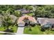 Exterior of a charming single-story house with a well-manicured lawn and lush landscaping at 6716 Frontier Ln, Tampa, FL 33625
