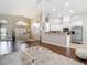 Bright and open living area with a kitchen, dining room, and hardwood floors at 6716 Frontier Ln, Tampa, FL 33625