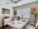 Bright office featuring a large white desk, contemporary decor, stylish artwork, and ceiling fan at 6716 Frontier Ln, Tampa, FL 33625
