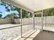 An enclosed patio that provides a perfect space to relax and unwind in a sheltered environment at 6716 Frontier Ln, Tampa, FL 33625