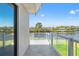 Balcony view overlooking the tranquil waterfront offers a seamless connection to nature and serene outdoor living space at 7049 Peninsular Dr, New Port Richey, FL 34652