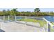 Balcony featuring stunning waterfront views, creating a serene outdoor living experience, perfect for relaxing and entertaining at 7049 Peninsular Dr, New Port Richey, FL 34652