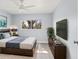 Comfortable bedroom with a modern design, large window, and stylish decor at 7049 Peninsular Dr, New Port Richey, FL 34652