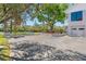 The home's driveway is surrounded by lush landscaping and provides ample parking for guests and residents at 7049 Peninsular Dr, New Port Richey, FL 34652