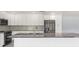 Modern kitchen with white cabinets, stainless steel appliances, and granite countertops at 7049 Peninsular Dr, New Port Richey, FL 34652