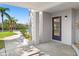 Covered patio with a view of tropical landscaping and serene canal at 7049 Peninsular Dr, New Port Richey, FL 34652