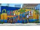 Colorful New Port Richey mural showing the beauty of the area as it is being painted at 7049 Peninsular Dr, New Port Richey, FL 34652