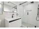 Modern bathroom featuring a glass-enclosed shower, stylish vanity, and contemporary fixtures at 7804 N Whittier St, Tampa, FL 33617