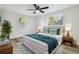 Calming bedroom with hardwood floors, natural light, and a cozy ambiance, creating a peaceful retreat at 7804 N Whittier St, Tampa, FL 33617