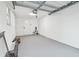 Clean, bright garage space with painted walls, new garage door, and ample room for parking and storage at 7804 N Whittier St, Tampa, FL 33617
