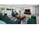 Stylish living room with modern furnishings, hardwood flooring, and ample natural light, creating a welcoming space at 7804 N Whittier St, Tampa, FL 33617
