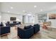 Spacious living room featuring hardwood floors, modern decor, and ample seating, perfect for entertaining guests at 7804 N Whittier St, Tampa, FL 33617