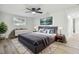 Relaxing main bedroom with a neutral color palette, ceiling fan, and hardwood floors, creating a serene retreat at 7804 N Whittier St, Tampa, FL 33617