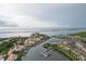Aerial view showcases waterfront community with docks, boat slips, and waterway access at 8707 Sailmaker Ct, Tampa, FL 33615
