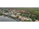 Aerial view of community, waterfront property, and boats at the docks at 8707 Sailmaker Ct, Tampa, FL 33615