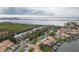 Aerial view of waterfront homes with docks and boat slips leading to open water at 8707 Sailmaker Ct, Tampa, FL 33615