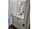 Bathroom featuring a white vanity with dark hardware and tile flooring at 8707 Sailmaker Ct, Tampa, FL 33615