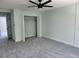Large bedroom with attached closet and large windows at 8707 Sailmaker Ct, Tampa, FL 33615