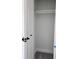 Well-lit closet with rod for hanging clothes and carpeted floor at 8707 Sailmaker Ct, Tampa, FL 33615