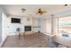 Well-lit clubhouse with fireplace and access to an outdoor terrace at 8707 Sailmaker Ct, Tampa, FL 33615