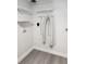 Laundry room with shelves and washer/dryer hookups; new flooring at 8707 Sailmaker Ct, Tampa, FL 33615