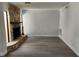 Bright living room featuring gray floors, a stone fireplace and views outside the window at 8707 Sailmaker Ct, Tampa, FL 33615