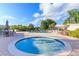 Relaxing community hot tub and pool area with ample seating at 8707 Sailmaker Ct, Tampa, FL 33615