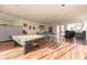 The recreation room features a pool table, ping pong table, and comfortable seating at 8707 Sailmaker Ct, Tampa, FL 33615